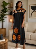Robe longue noire à motifs africains orange et beige